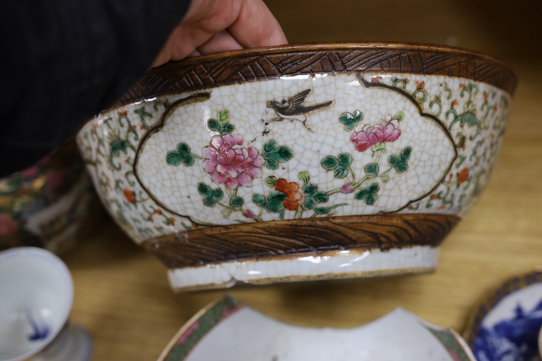 A group of mixed ceramics and an enamel brush